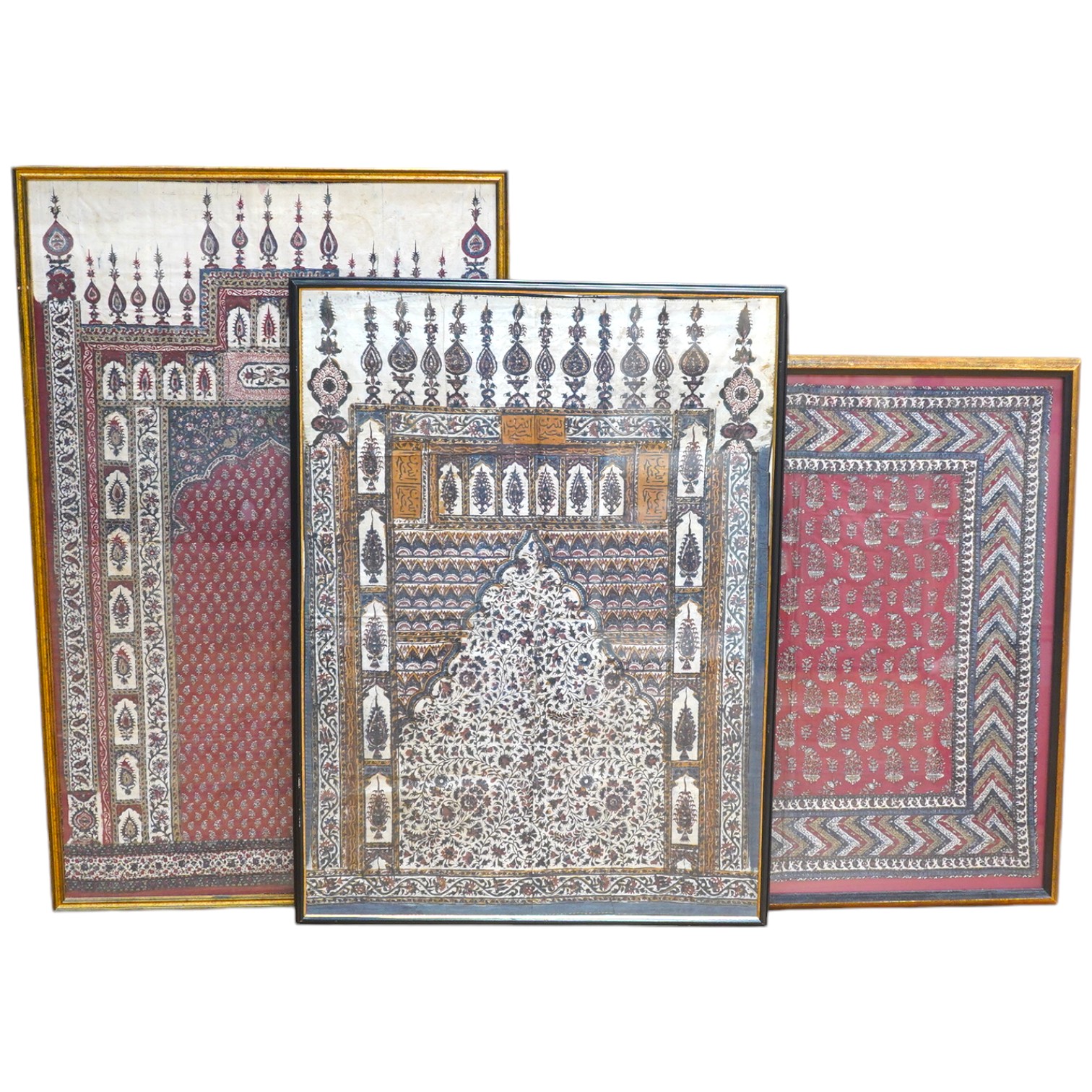 Two framed 19th century Indian Kalamkari boteh block printed prayer Niches, possibly from Machilitanam and a similar framed block printed square, possibly part of a table cover, largest 53cm wide x 67cm high (3). Conditi